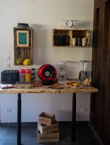 a table with food on it in a room at Chambres 2 caps in Ambleteuse