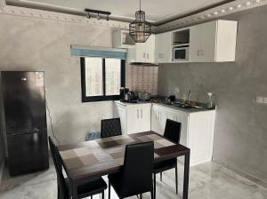 Una cocina o cocineta en Appartement meublé