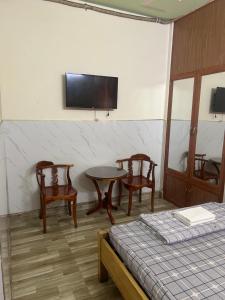 TV a/nebo společenská místnost v ubytování Nhà nghỉ bình dân
