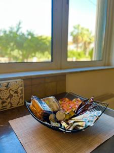 a bowl of food sitting on top of a table at Mesogaia Home Near ATH Airport in Markopoulo +8 photos