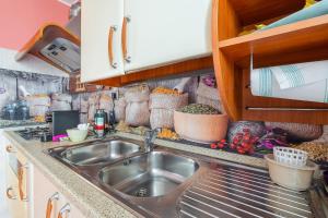 a kitchen with a sink and a counter top at La Casa Del Vagabondo in Belvedere +31 photos