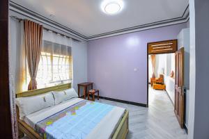 Postel nebo postele na pokoji v ubytování Peacewell Home