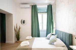 Ένα ή περισσότερα κρεβάτια σε δωμάτιο στο Rooftop14 Suite&Relax