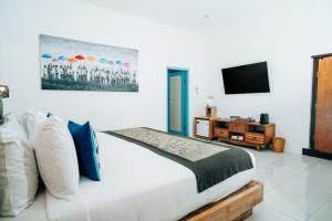 Televiisor ja/või meelelahutuskeskus majutusasutuses Sanur House