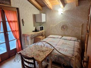 Ένα ή περισσότερα κρεβάτια σε δωμάτιο στο Agriturismo La Ca' Vegia