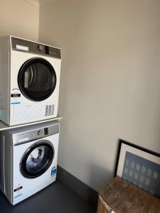 a washing machine and a dryer in a room at Hilltop Getaway in Ocean View