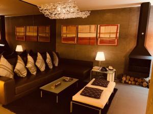 a living room with a couch and a table at Casita Malvika in Costa Teguise