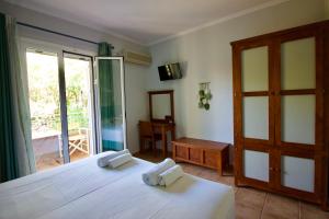 Ένα ή περισσότερα κρεβάτια σε δωμάτιο στο Aggelina's Apartments