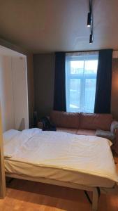 Postel nebo postele na pokoji v ubytování The Guest Apartment