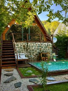 a house with a swimming pool next to a house at Merce Bungalov in Sakarya