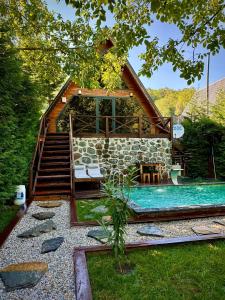 a house with a swimming pool in the yard at Merce Bungalov in Sakarya
