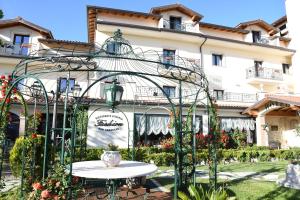 a table in front of a building at Fashion Hotel in Valmontone