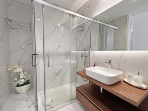 a bathroom with a sink and a shower at Lady Delmar Marina Olhao By Junto ao Mar in Olhão +58 photos
