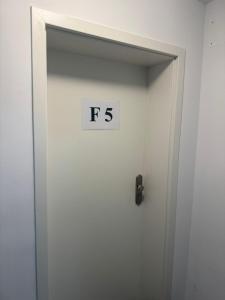 an elevator door with the sign on it at F5 - 2 Zimmer Wohnung in Offenbach +10 photos