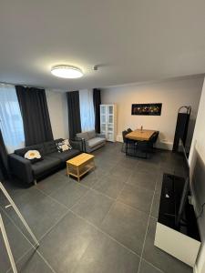 a living room with a couch and a table at F5 - 2 Zimmer Wohnung in Offenbach