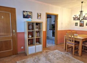 a kitchen and dining room with a table and a dining room at Ferienwohnung im Herzen der Lausitz in Groß Düben