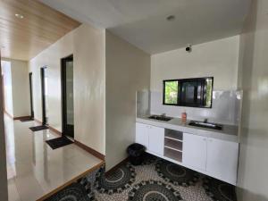 a bathroom with two sinks and a mirror at Pacific Paradise Guesthouse in Ubay +58 photos