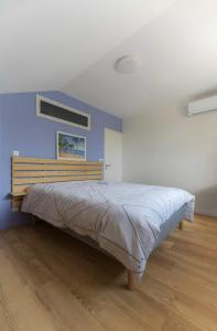 Postel nebo postele na pokoji v ubytování Résidence Penaud - Appartements design et climatisés à la campagne