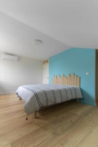 Postel nebo postele na pokoji v ubytování Résidence Penaud - Appartements design et climatisés à la campagne + 61 fotografií