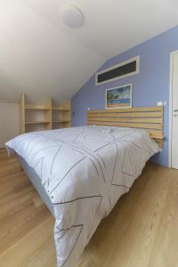 Postel nebo postele na pokoji v ubytování Résidence Penaud - Appartements design et climatisés à la campagne