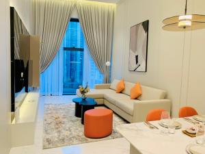 a living room with a couch and a table at Eaton Delight Residences in Kuala Lumpur