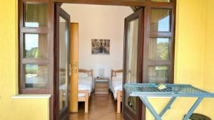 a room with a room with a bed and a table at VILLAMAR beachfront apartments with FREE private parking in Rabac