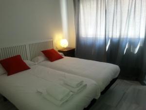 Posteľ alebo postele v izbe v ubytovaní Apartamento Buhaira