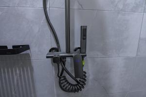 a phone is hanging on a wall at Guadalupe house in Masaka +34 photos