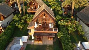 an aerial view of a house with a roof at Laguava Resort in Ar Rumaylah