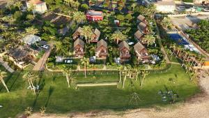 an aerial view of a house with palm trees at Laguava Resort in Ar Rumaylah +72 photos