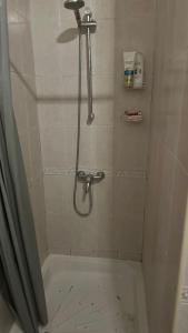 a bathroom with a shower stall with a shower at Berry in Setúbal