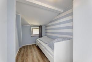 Ένα ή περισσότερα κρεβάτια σε δωμάτιο στο Fewo Susi