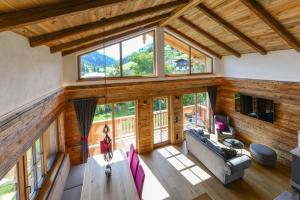 an overhead view of a living room with a large window at Gams Lodge in Enkerbichl