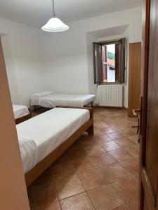 Ένα ή περισσότερα κρεβάτια σε δωμάτιο στο Casetta Pierluigi