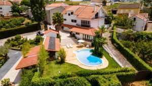 an aerial view of a house with a swimming pool at Casa da Joana, Quinta Carmo - Alcobaça/Nazaré in Alcobaça
