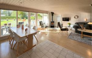 a living room with a table and a couch at 3 Bedroom Pet Friendly Home In Hemmet in Falen