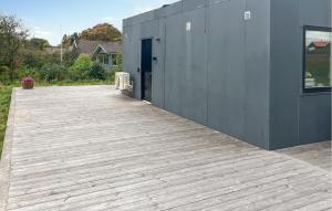 a wooden ramp leading to a building with a door at 3 Bedroom Beautiful Home In Hurup Thy in Doverodde