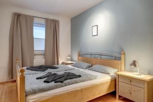 a bedroom with a bed with two towels on it at Fewo Melli in Zempin