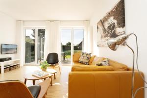 TV a/nebo společenská místnost v ubytování Ferienhaus Haltermann