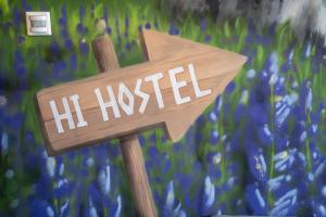 a wooden sign with the word he himself on it at Loft - HI Eco Hostel in Reykjavík