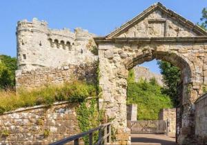 an entrance to an old stone building with an arch at Oyster Catchers in Ryde