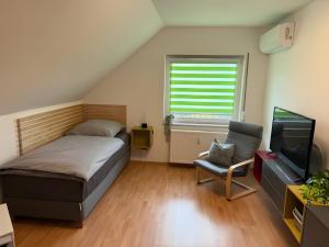 Postel nebo postele na pokoji v ubytování Pension Hettstedt