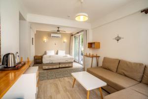 a living room with a bed and a couch at Hideaway in Kas
