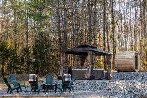 a group of chairs and a table in front of a tent at Stratton Ski Haus in Jamaica