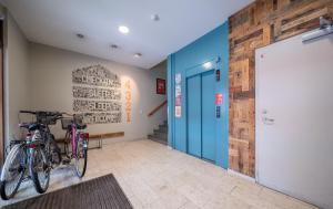 two bikes parked on the wall in a hallway at Loft - HI Eco Hostel in Reykjavík