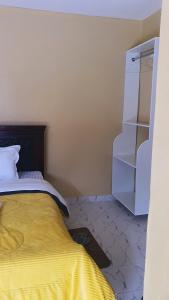Ένα ή περισσότερα κρεβάτια σε δωμάτιο στο SIGNATURE GUEST HOUSE-Maasai Mara