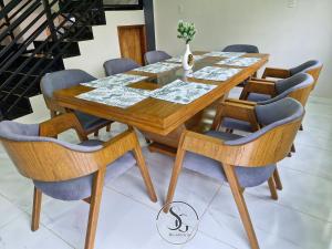 a dining room table with chairs around it at Residencia SG - Casa Duplex in Encarnación