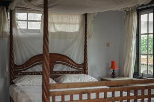 Ένα ή περισσότερα κρεβάτια σε δωμάτιο στο Adams homestay