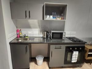 Dapur atau dapur kecil di Sandton Cityscape Studio