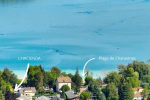 an aerial view of the lake and the city of margarica and place at L'HACIENDA DUO a romantic getaway with a private spa in Charavines +24 photos